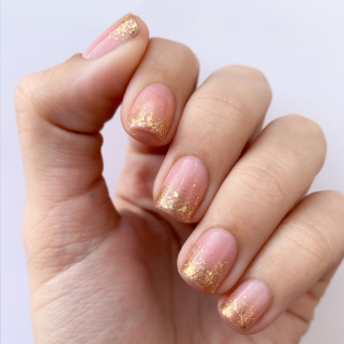 Short nails with golden glitter tips from Cirque Colors